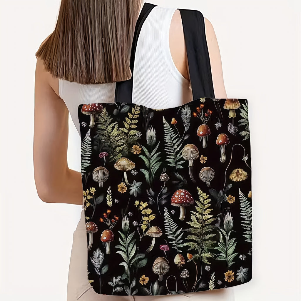 Tote bag with nature-themed design featuring mushrooms and plants held by a person.