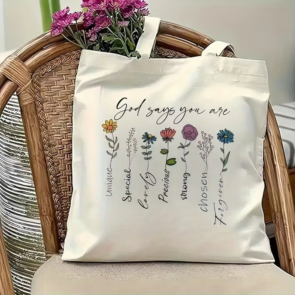 Tote bag with Christian floral scripture tote quote and flowers on a chair