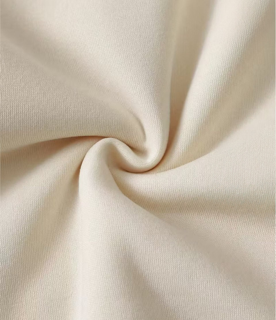 Close-up of beige fabric with folds